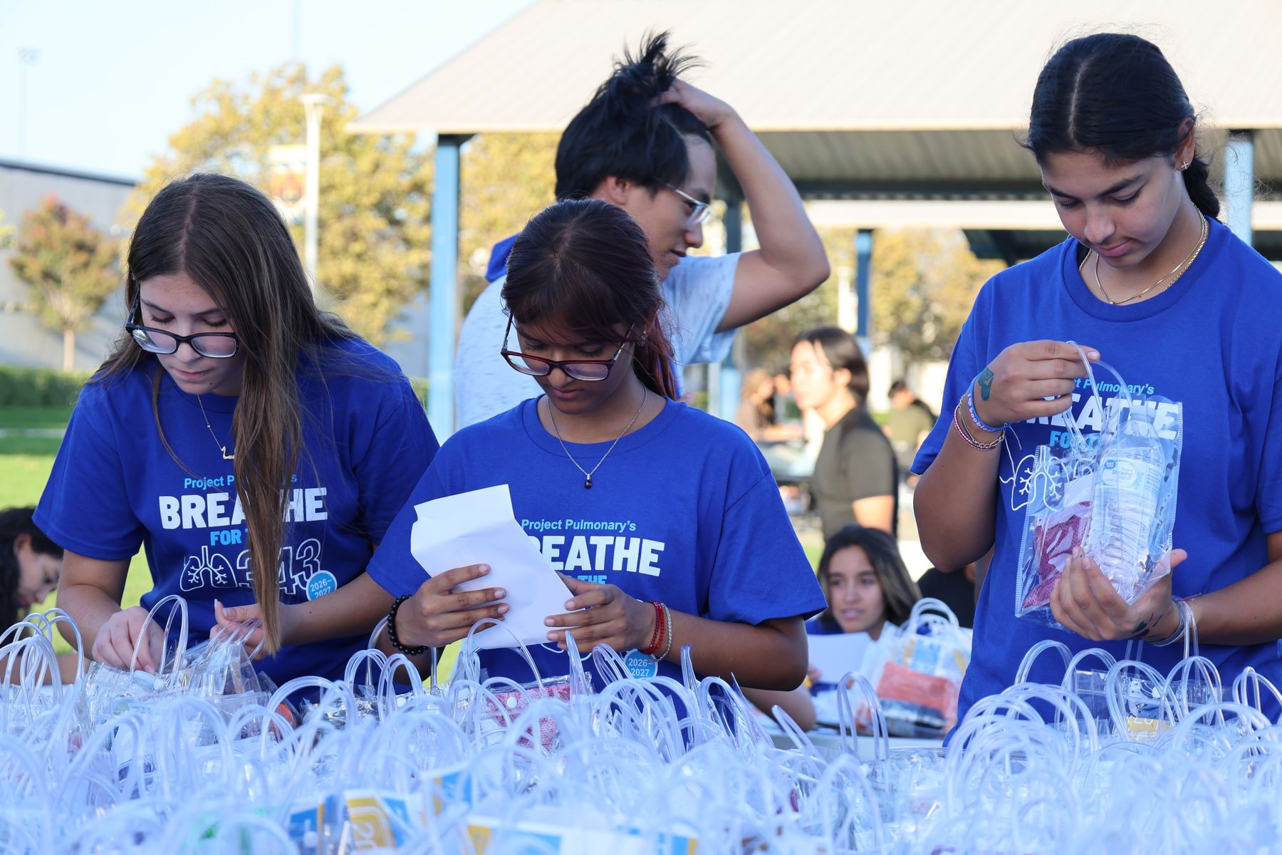 Volunteers in Breathe for the 343 shirts packing kits