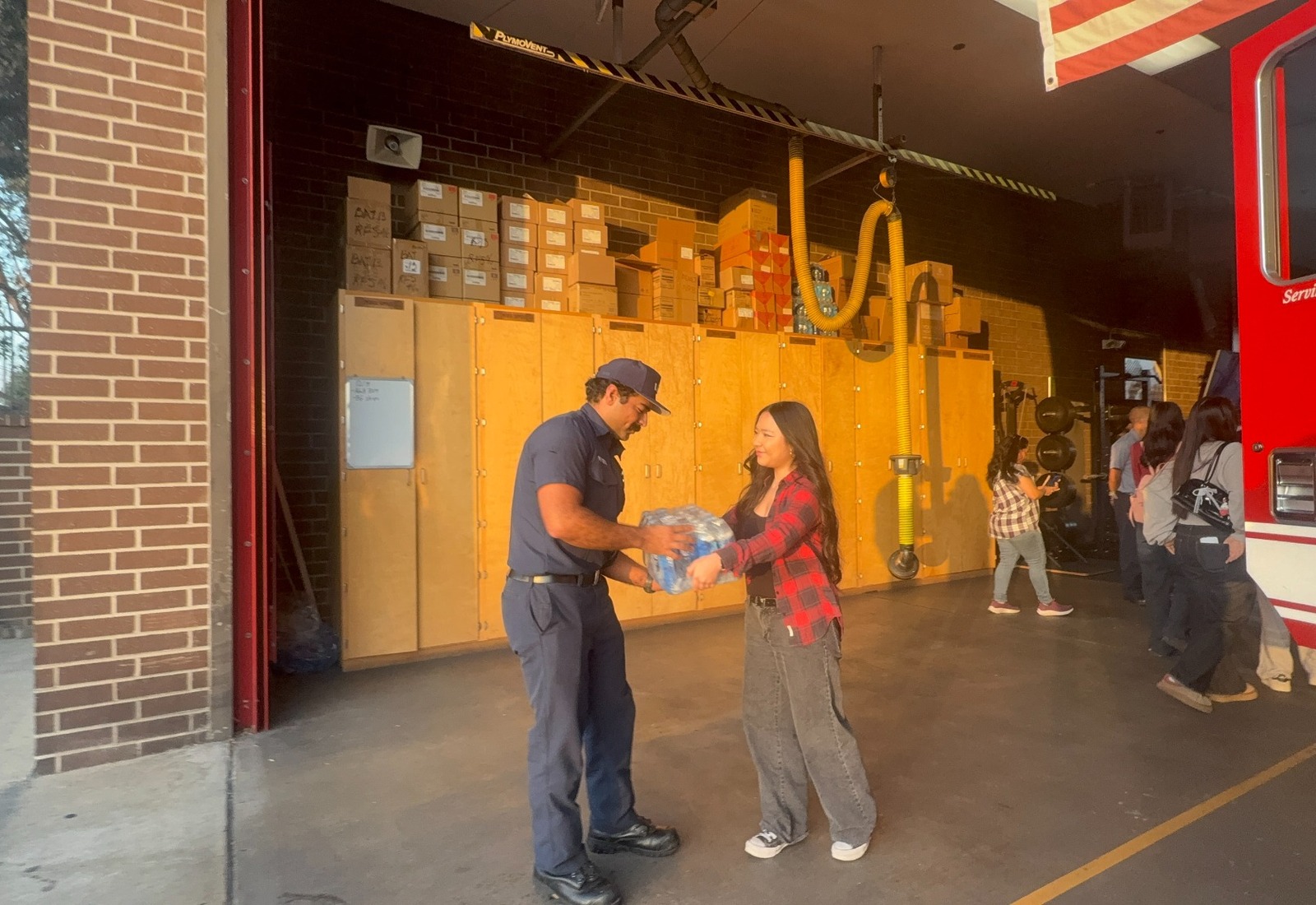 Project Pulmonary volunteers hosting a hydration drive and delivering bottled water