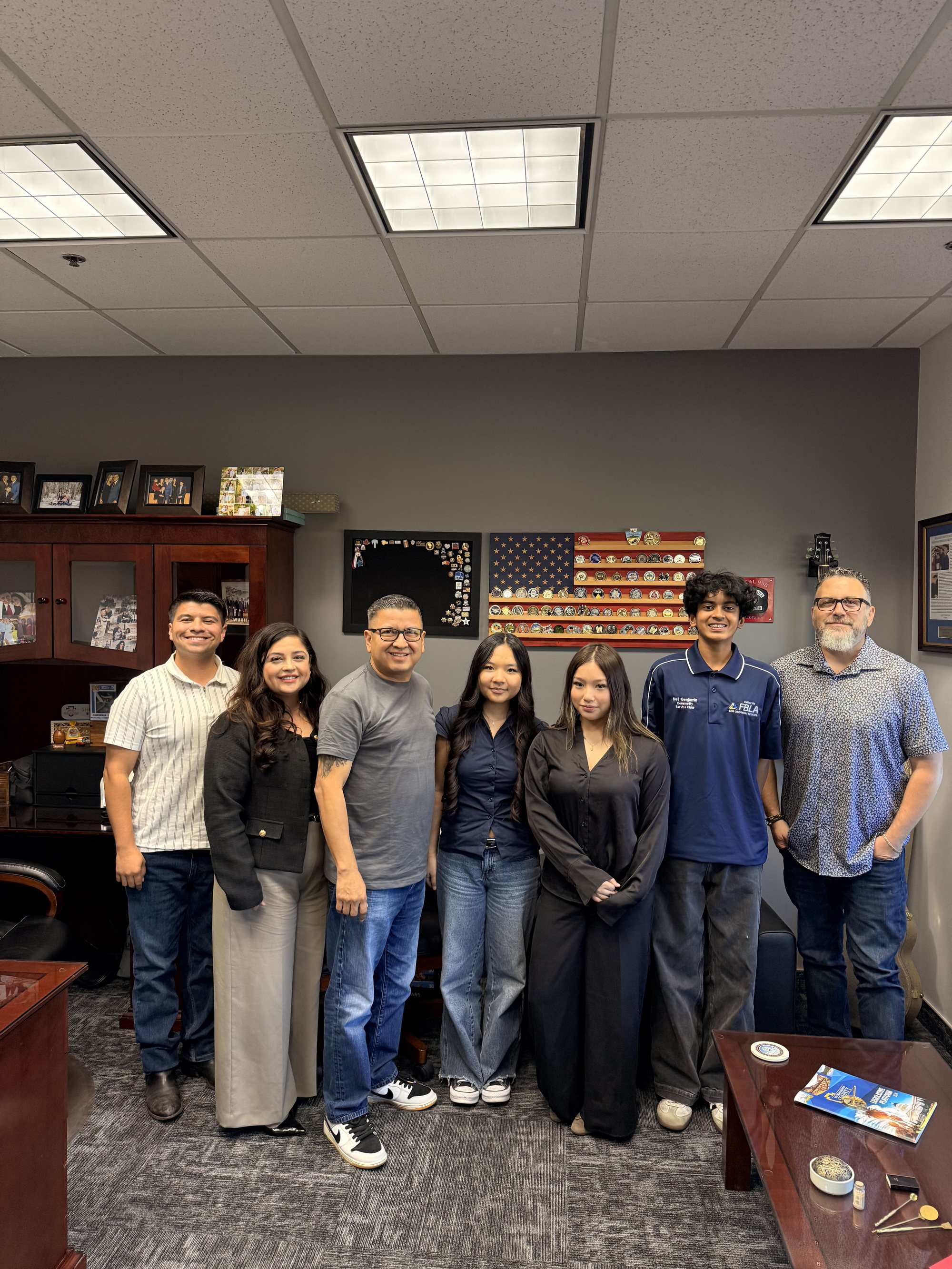 Project Pulmonary students with LA County firefighters holding hydration donations