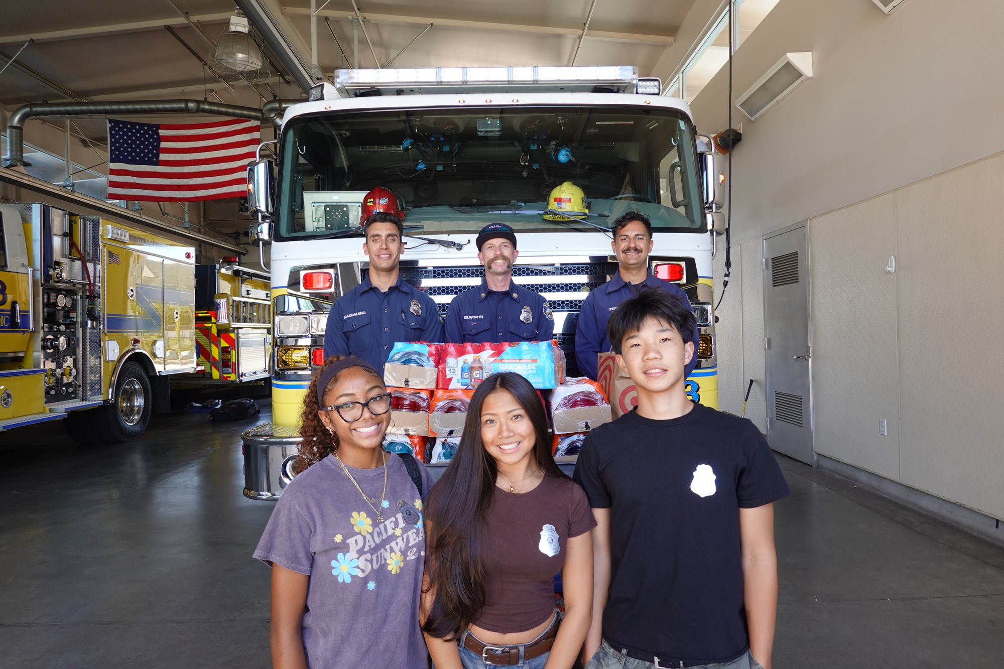 Project Pulmonary students and Ventura County firefighters with hydration donations in a fire station